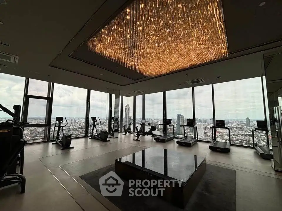 Luxurious high-rise gym with panoramic city views and modern equipment