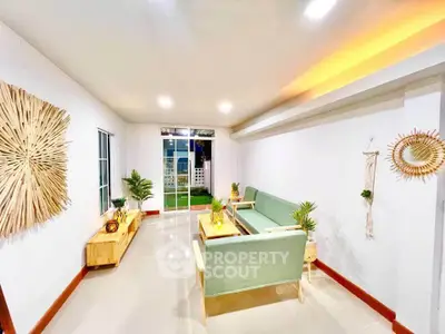 Bright and modern living room with stylish decor and large windows.