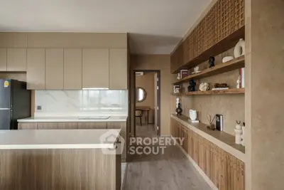 Modern kitchen with sleek cabinetry and open shelving design
