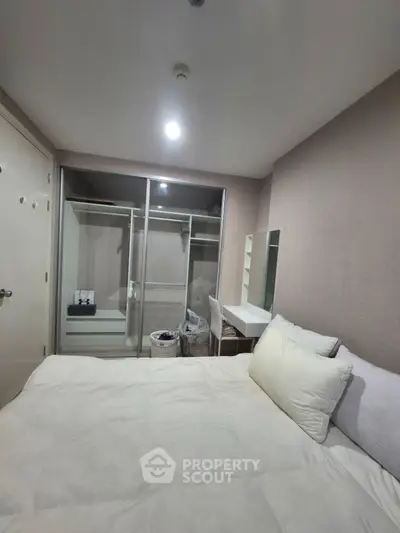 Modern bedroom with built-in wardrobe and cozy decor