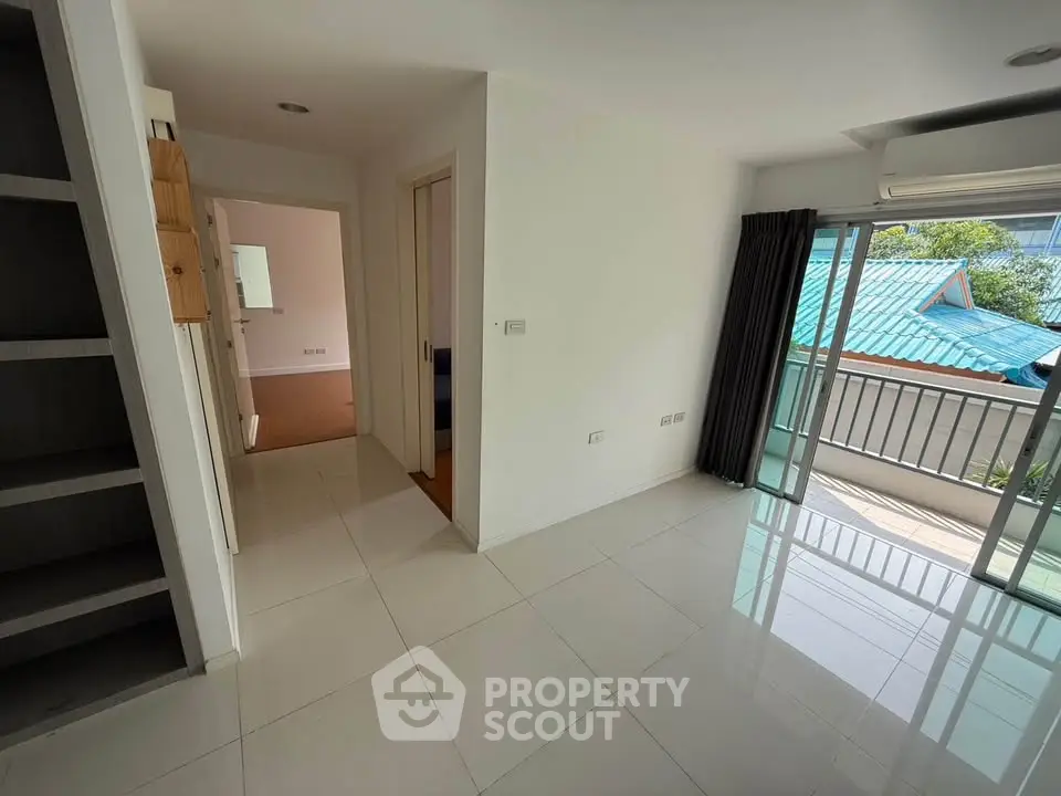 Bright and airy living space with balcony access and modern finishes.