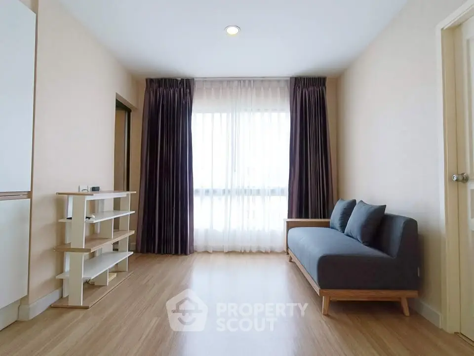 Modern living room with wooden flooring and stylish sofa in a bright apartment