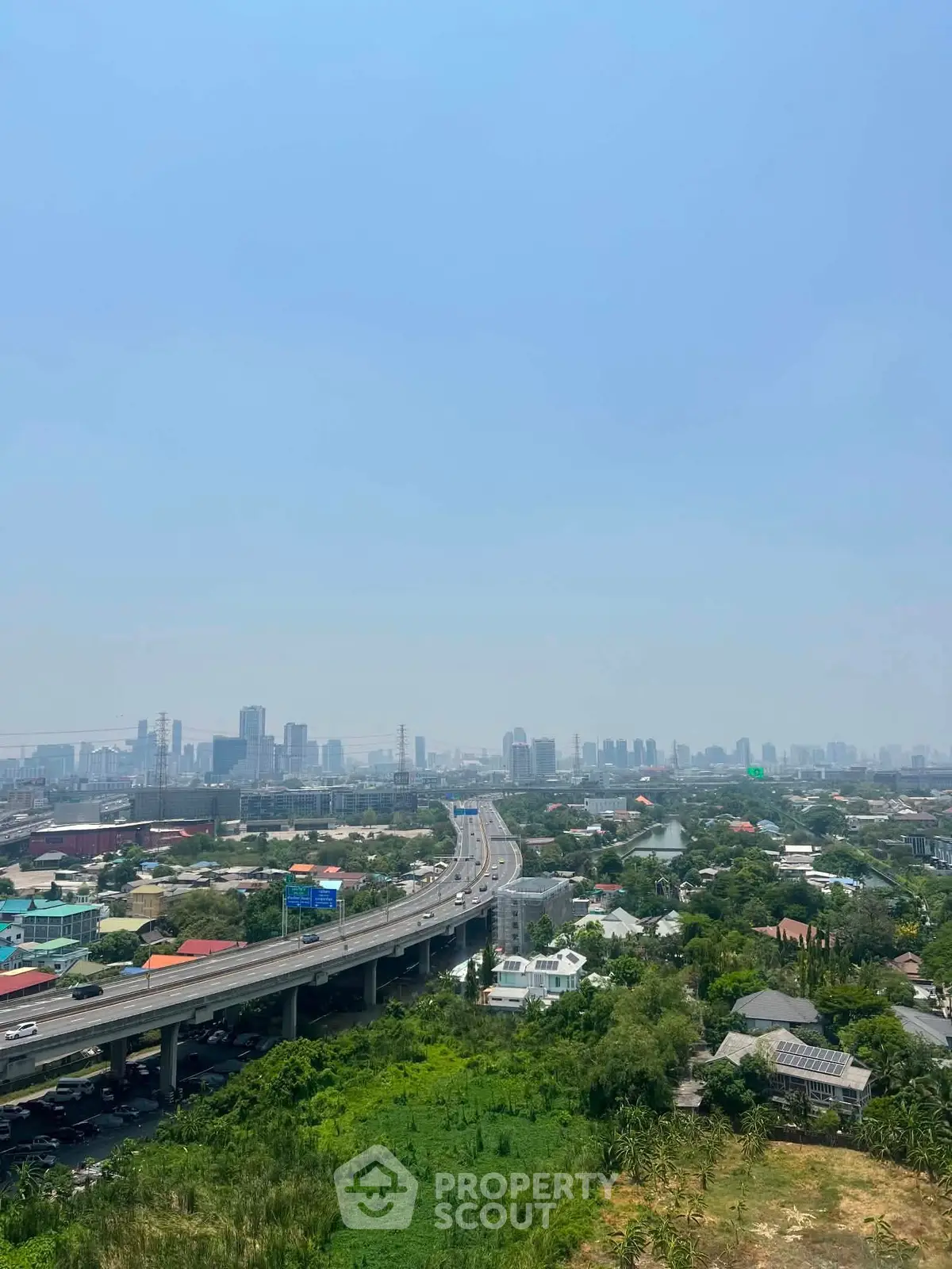 Stunning cityscape view with highway and skyline, perfect for urban living enthusiasts.