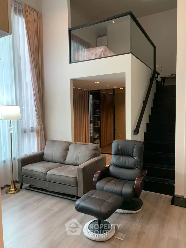 Modern duplex living room with mezzanine and stylish furniture