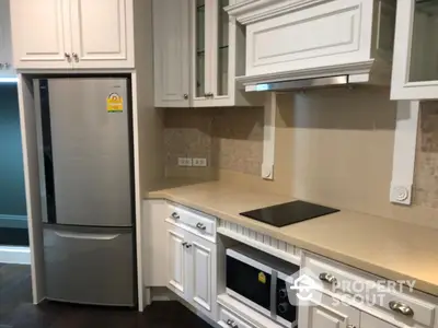 Modern kitchen with sleek appliances and elegant cabinetry