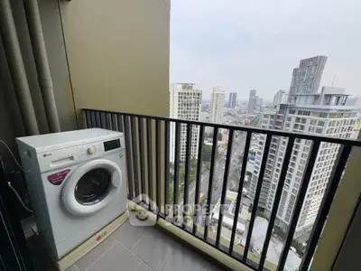 High-rise balcony with city view and washing machine, perfect for urban living.
