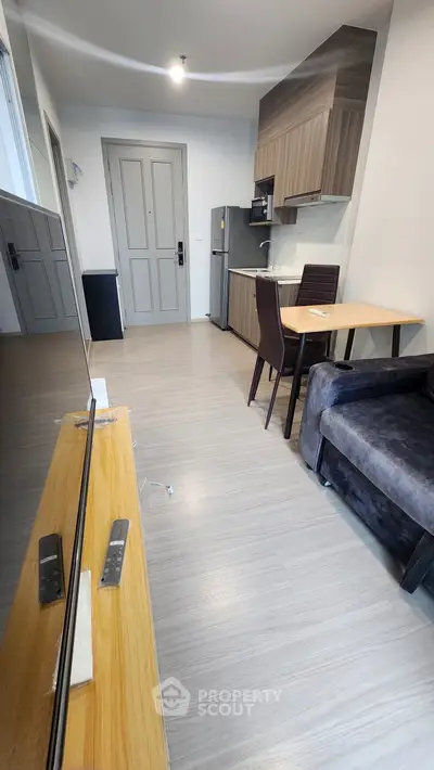 Modern apartment interior with sleek kitchen and cozy living area