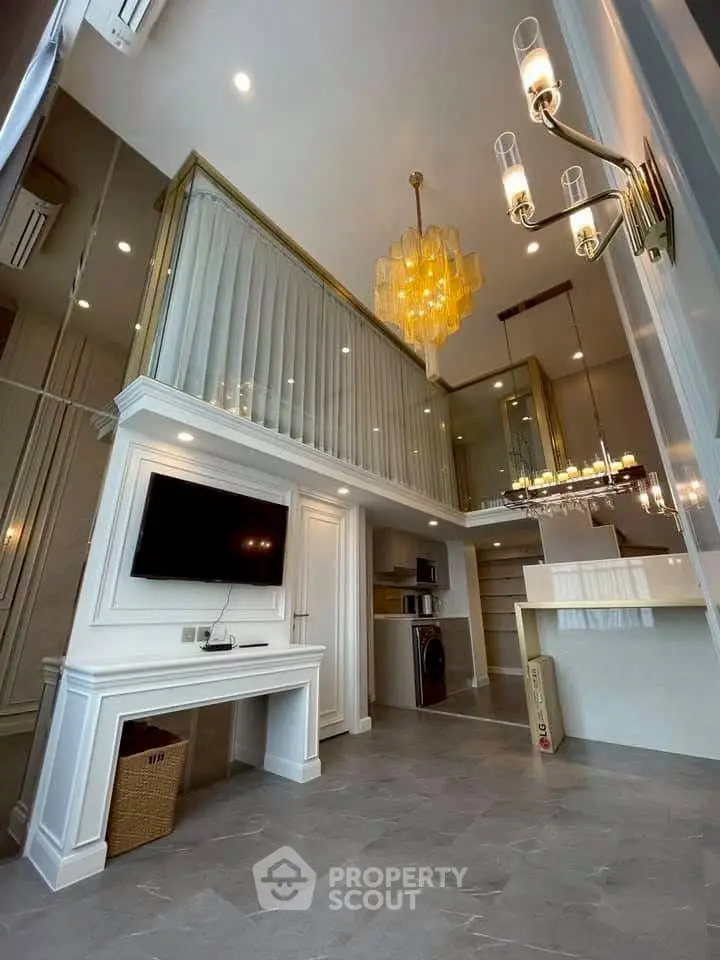 Luxurious modern living room with high ceiling and elegant chandelier