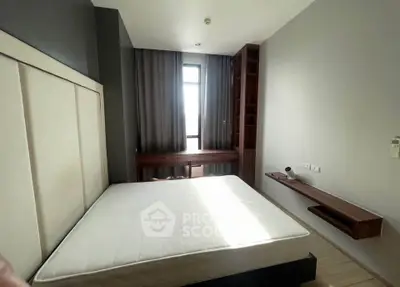 Modern bedroom with large window and stylish wooden furniture