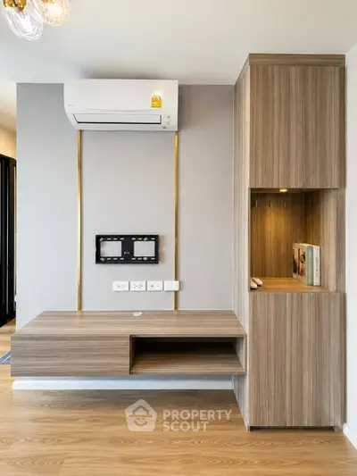 Modern interior with built-in wooden storage and air conditioning unit, perfect for efficient living space.