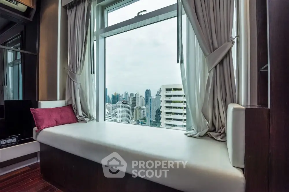 Luxurious window seat with stunning city view in modern apartment