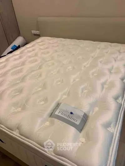 Luxurious bedroom with plush mattress and elegant headboard for ultimate comfort.