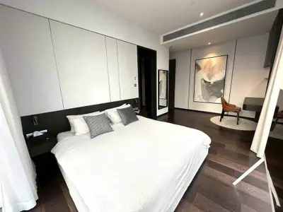 Luxurious modern bedroom with elegant decor and hardwood floors