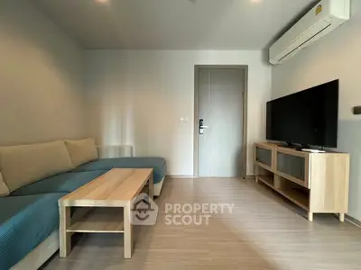 Modern living room with sleek furniture and air conditioning, perfect for comfortable living.