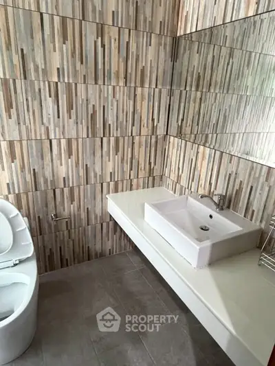 Modern bathroom with stylish tile design and sleek fixtures