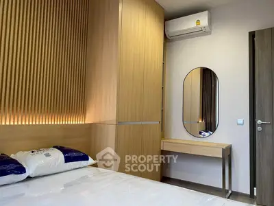 Modern bedroom with stylish wooden paneling and sleek air conditioning unit