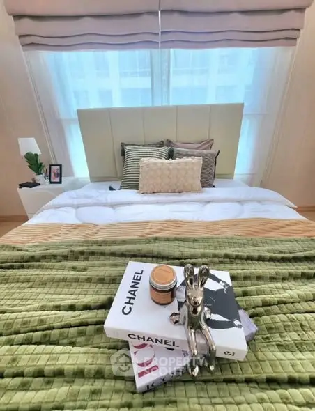 Luxurious bedroom with designer decor and plush bedding in a modern apartment.