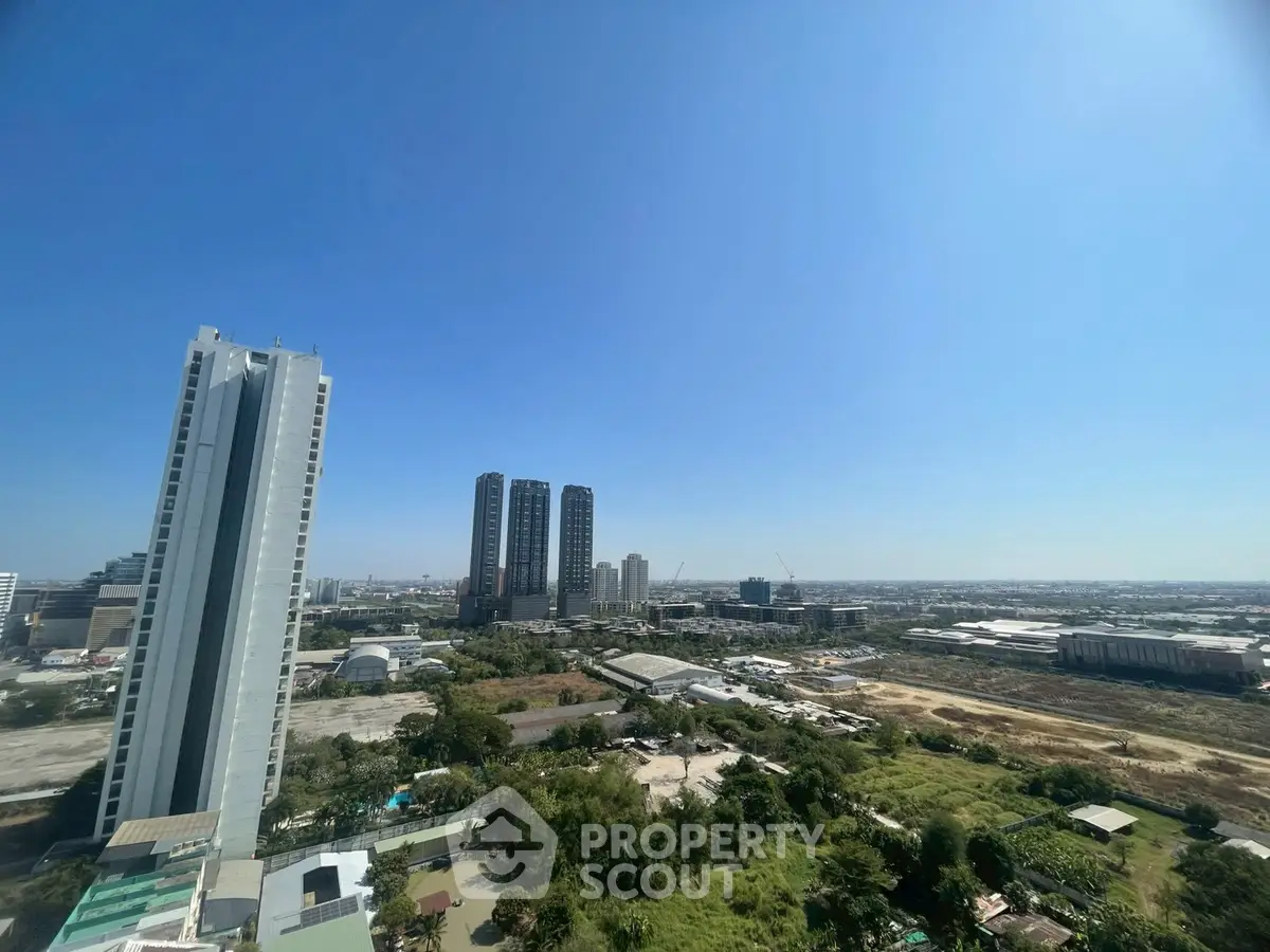 Stunning cityscape view from high-rise building with clear blue sky