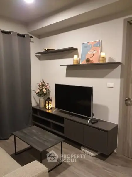 Modern living room with stylish decor and wall-mounted TV unit