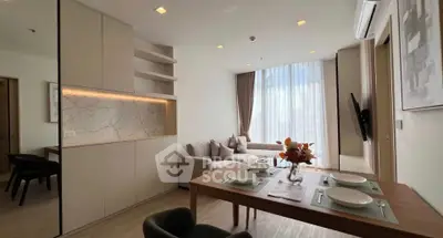 Modern living room with elegant dining area and natural light