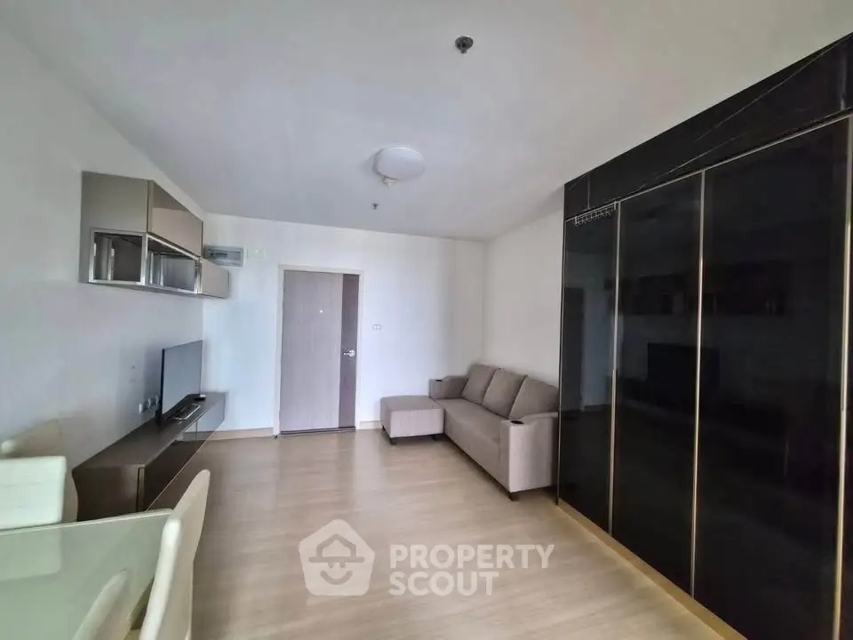 Modern living room with sleek furniture and ample natural light
