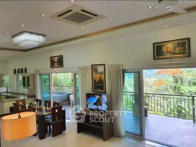 Spacious living room with large balcony and scenic view in modern home