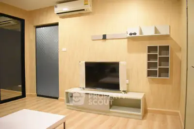 Modern living room with sleek TV unit and wall-mounted shelves