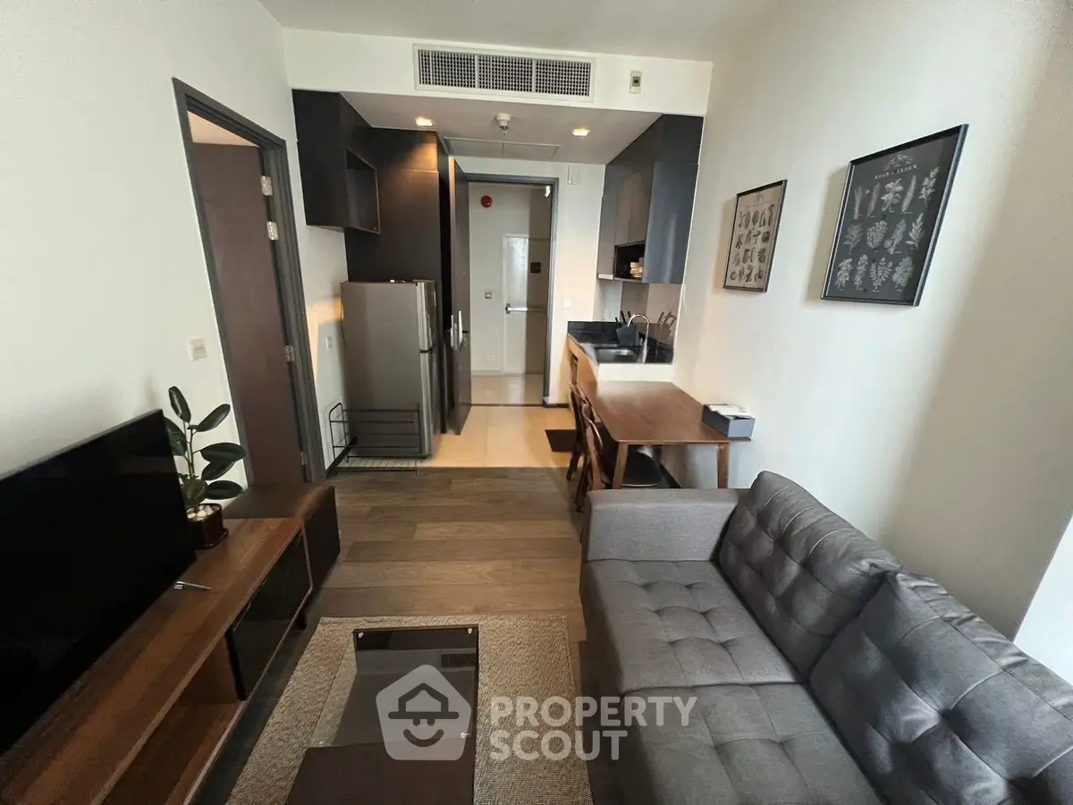Modern living room with sleek kitchen in open layout apartment