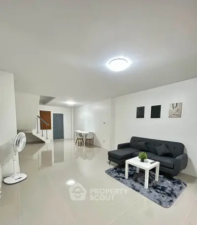 Spacious modern living room with sleek furniture and minimalist decor