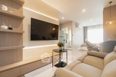 Modern living room with sleek design, featuring a large TV, cozy sofa, and elegant decor.