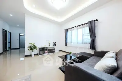Spacious modern living room with elegant decor and natural light