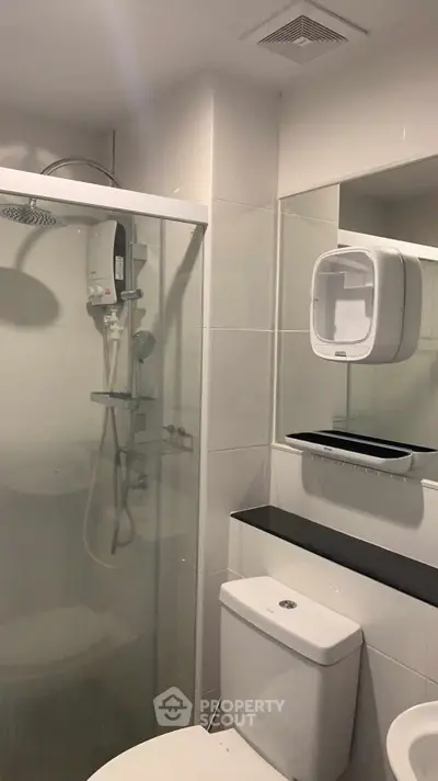 Modern bathroom with glass shower and sleek fixtures