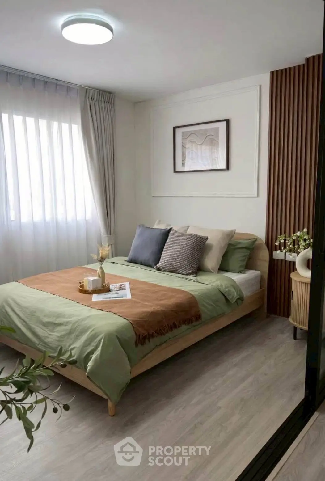 Cozy modern bedroom with stylish decor and natural light