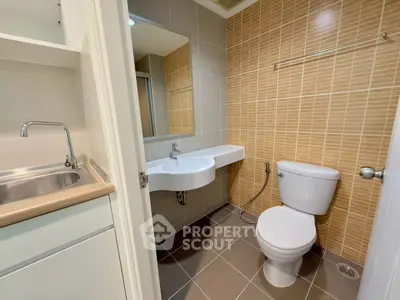 Modern bathroom with sleek fixtures and neutral tile design