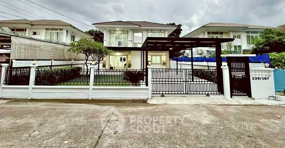 Stunning two-story house with modern design and spacious front yard in a serene neighborhood.