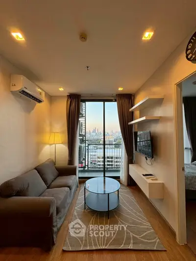 Modern living room with city view, cozy sofa, and stylish decor