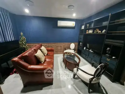 Cozy living room with leather sofa, elegant decor, and air conditioning