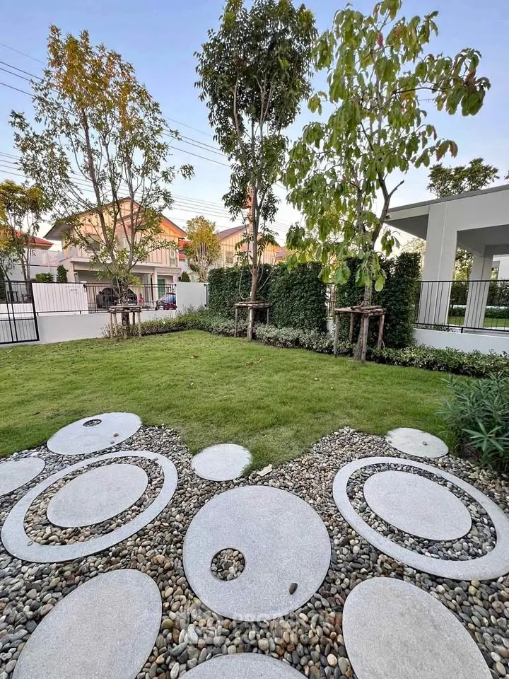 Charming garden with unique circular stone pathway and lush greenery