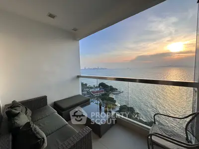 Stunning ocean view from a modern balcony at sunset, perfect for relaxation.