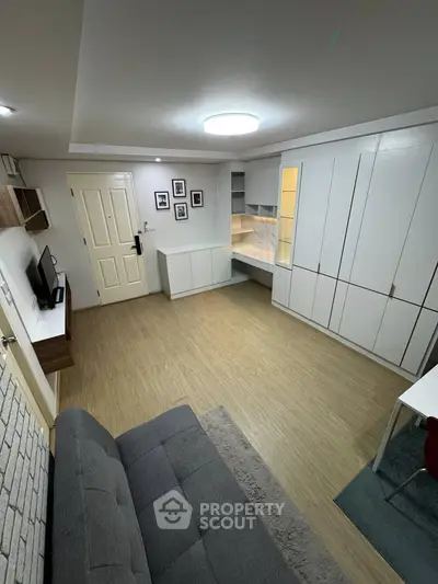 Modern living room with stylish furniture and ample storage space