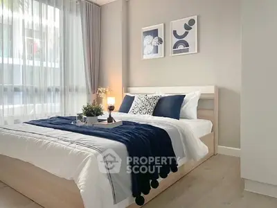 Modern bedroom with stylish decor and natural light