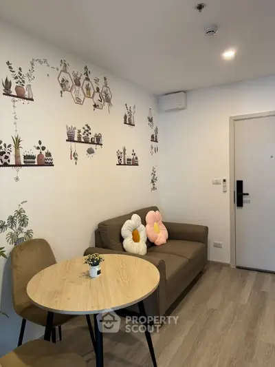 Charming living room with cozy seating and decorative wall art