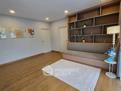 Spacious living room with modern shelving and elegant decor