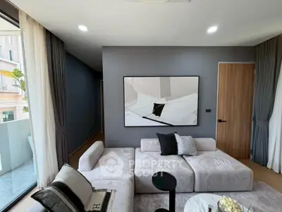 Modern living room with stylish decor and balcony access