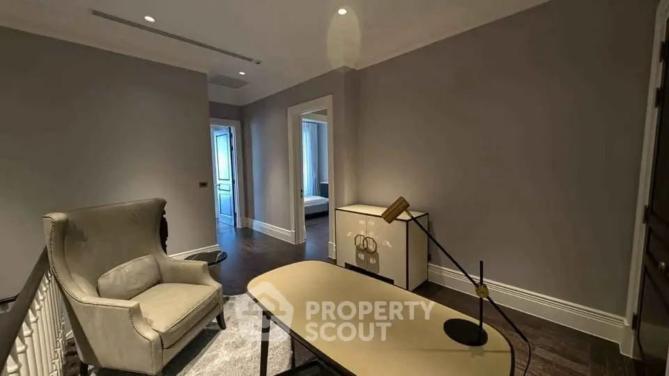 Elegant study room with modern desk and armchair in luxury apartment