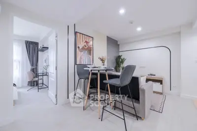 Modern open-plan living room with stylish decor and natural light