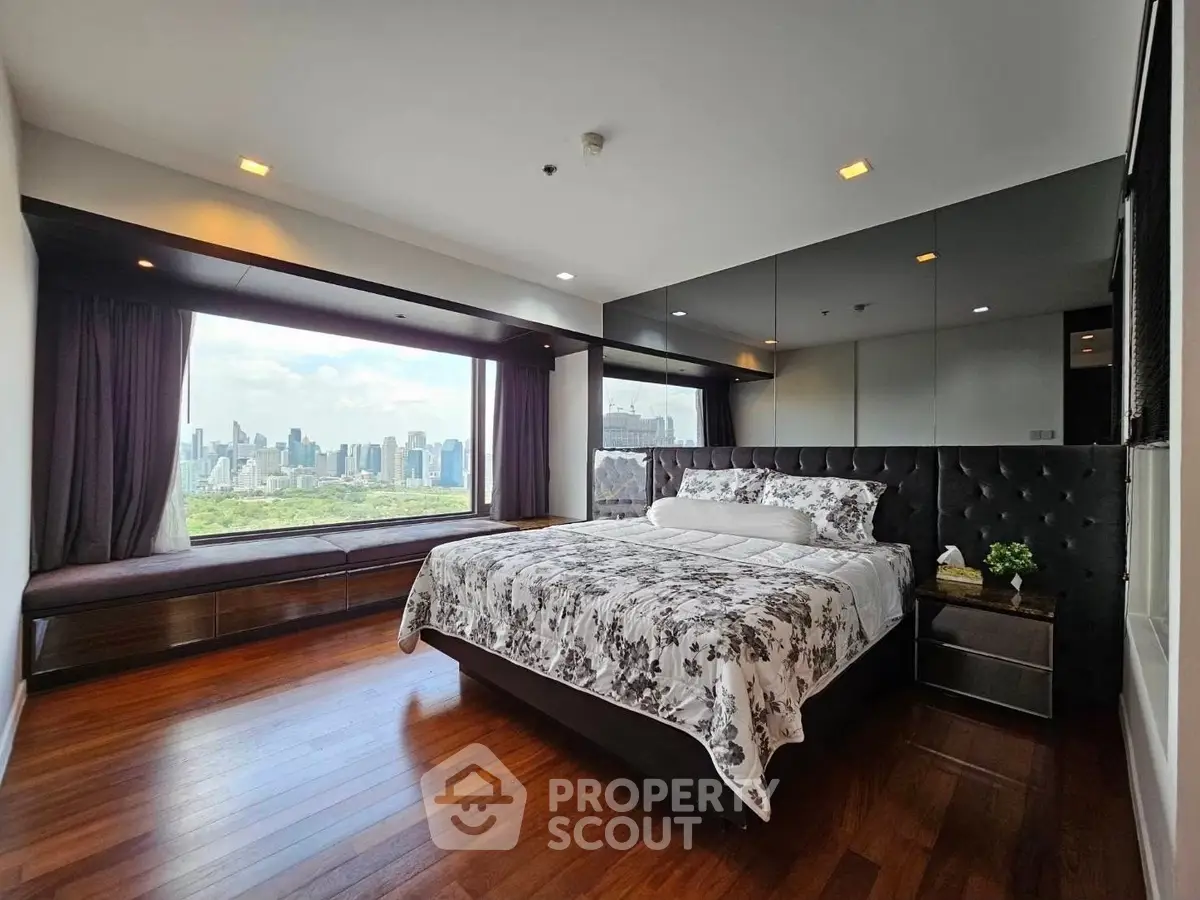 Luxurious bedroom with stunning city skyline view and elegant decor