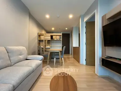 Modern living room with cozy sofa and stylish dining area