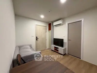 Modern living room with sleek furniture and air conditioning in a cozy apartment.