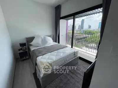 Modern bedroom with balcony view in urban apartment